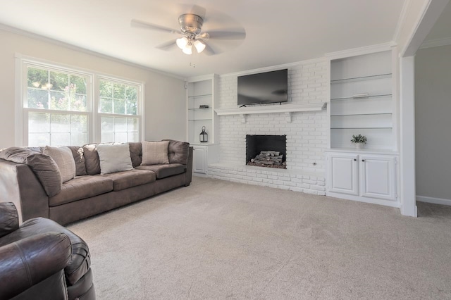 living room featuring a fireplace, light carpet, crown molding, ceiling fan, and built in features