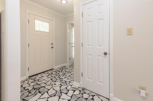 tiled entryway featuring ornamental molding