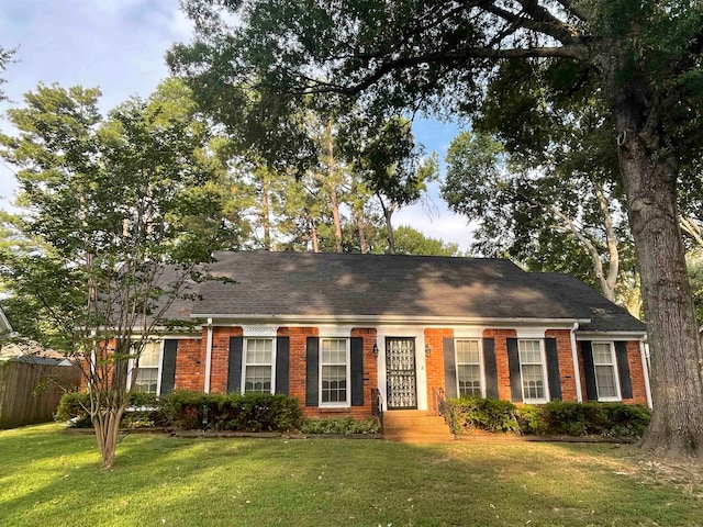 ranch-style house with a front yard