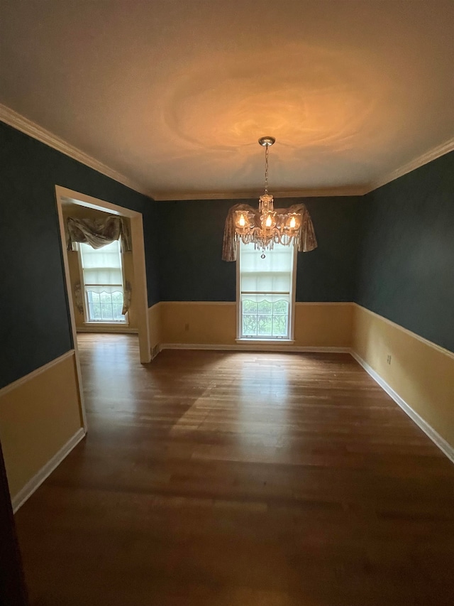 unfurnished dining area with ornamental molding and hardwood / wood-style flooring