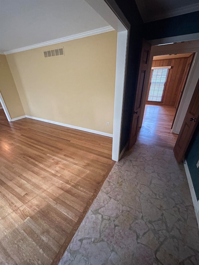 corridor featuring crown molding and hardwood / wood-style flooring