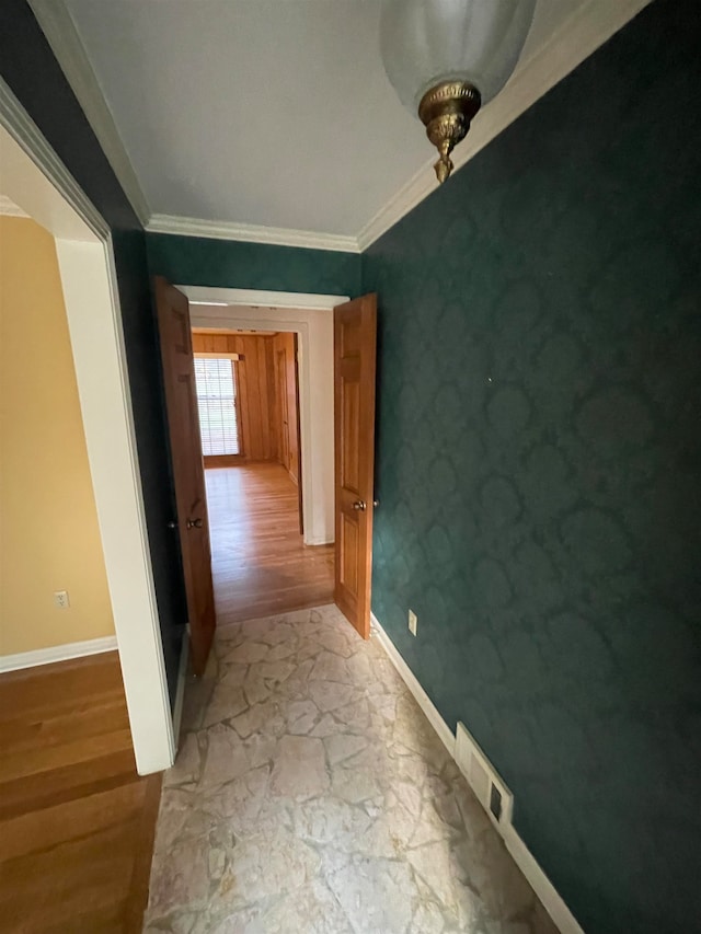 interior space featuring light hardwood / wood-style floors and ornamental molding