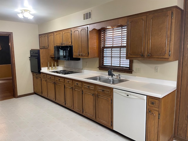 kitchen with black appliances and sink