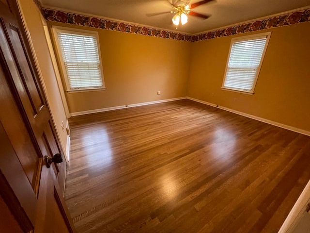 spare room with ceiling fan and hardwood / wood-style floors