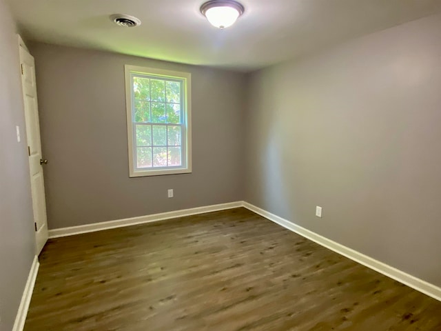 empty room featuring dark hardwood / wood-style floors