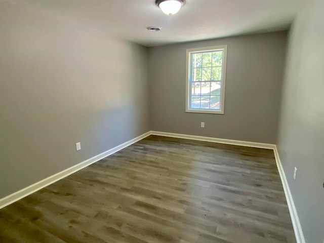 empty room featuring wood-type flooring