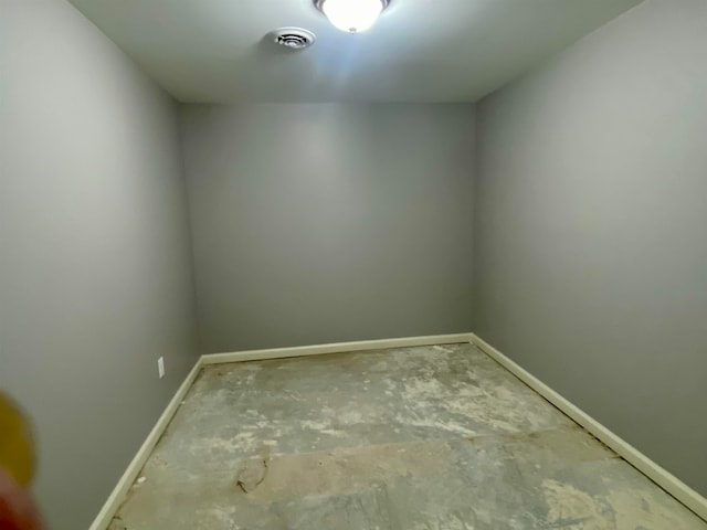 spare room with concrete flooring