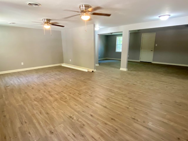 unfurnished room with wood-type flooring and ceiling fan