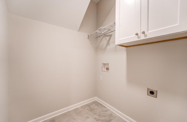 clothes washing area featuring cabinets, hookup for an electric dryer, and hookup for a washing machine