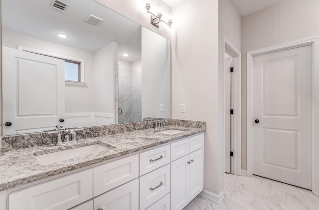 bathroom with vanity and an enclosed shower