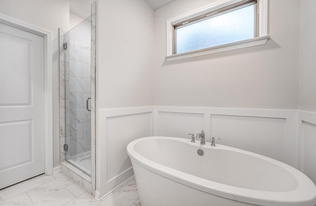 bathroom with separate shower and tub