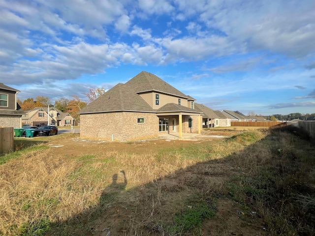 rear view of property featuring a residential view