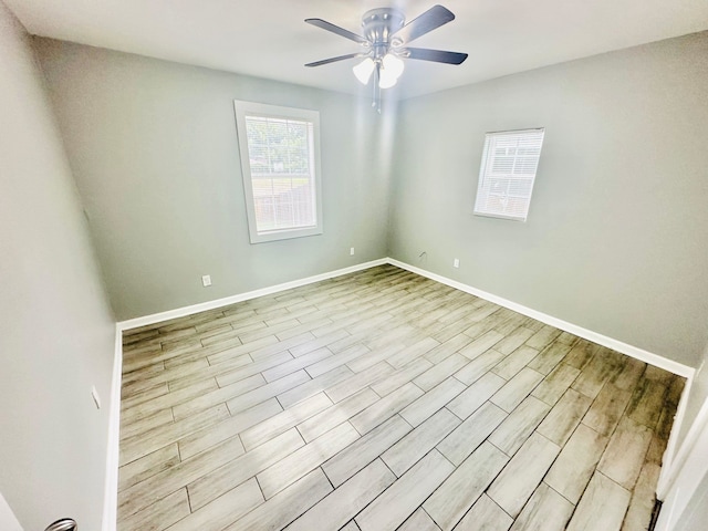 unfurnished room featuring ceiling fan and light hardwood / wood-style flooring