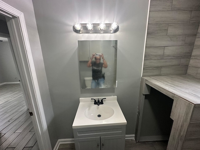 bathroom with wood-type flooring and vanity