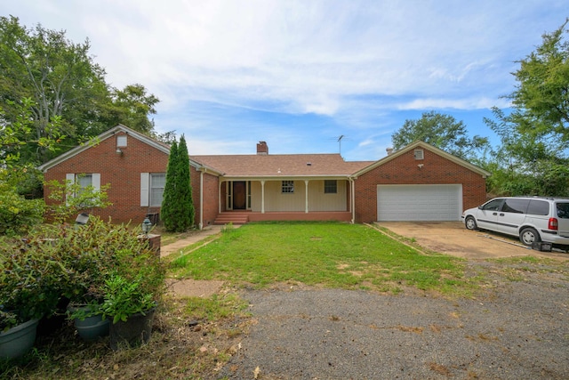 ranch-style home with a garage, a porch, and a front lawn