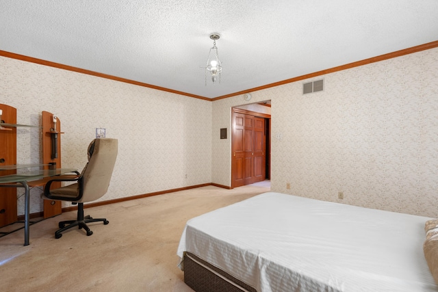 carpeted bedroom with a textured ceiling and crown molding