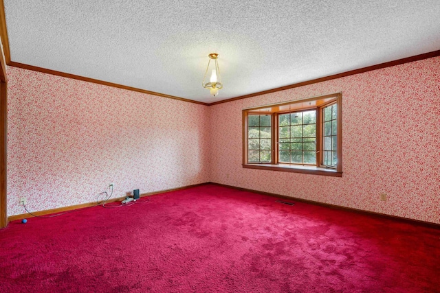 carpeted spare room featuring a textured ceiling and crown molding