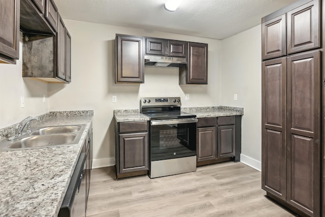 kitchen with light hardwood / wood-style floors, stainless steel appliances, a textured ceiling, dark brown cabinets, and sink