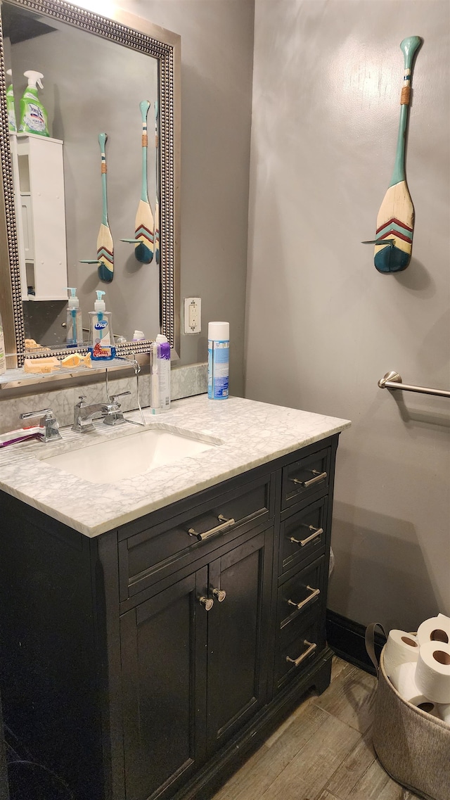 bathroom with wood-type flooring and vanity