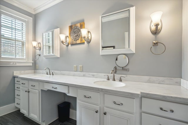 bathroom featuring crown molding and vanity