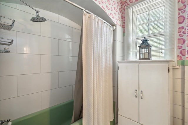 bathroom with shower / tub combo with curtain