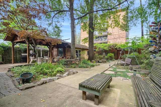 exterior space with a gazebo and a patio area