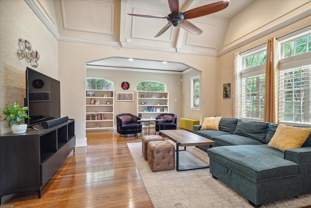 living room with vaulted ceiling, ceiling fan, hardwood / wood-style flooring, and plenty of natural light