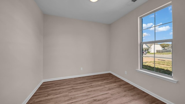 empty room with a healthy amount of sunlight and light wood-type flooring