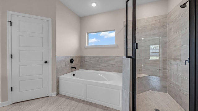 bathroom featuring plus walk in shower