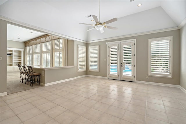 unfurnished room featuring light tile patterned floors, lofted ceiling, ceiling fan, and french doors