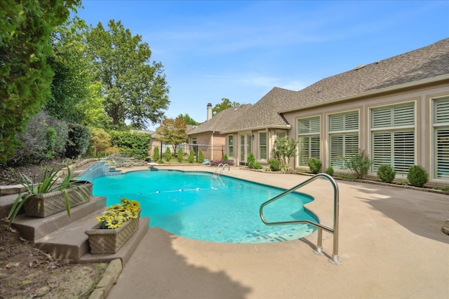 view of swimming pool with a patio