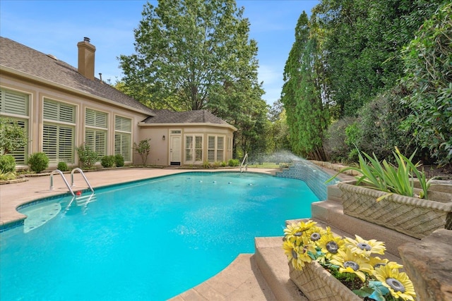 view of swimming pool with a patio area