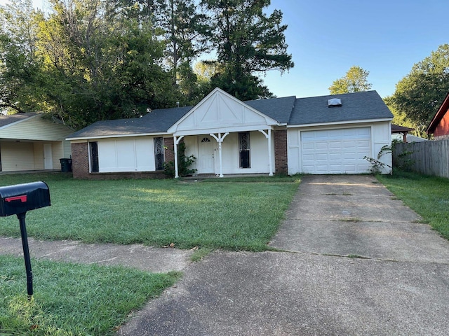 view of front of house featuring a garage and a front lawn