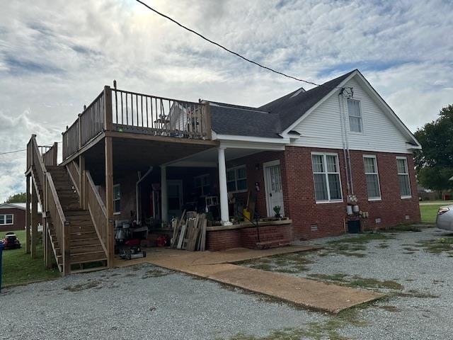 rear view of property featuring a patio