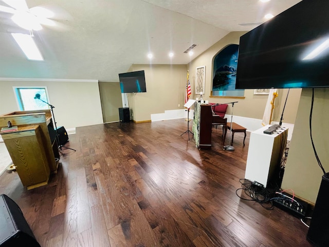 interior space featuring vaulted ceiling, ceiling fan, and dark hardwood / wood-style flooring