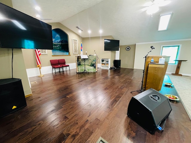 interior space with vaulted ceiling, ceiling fan, and hardwood / wood-style floors