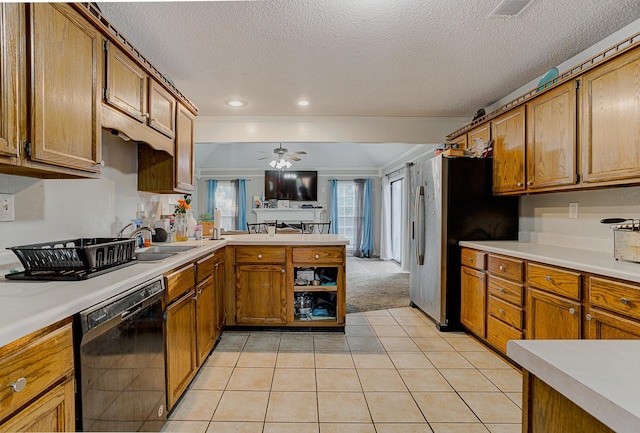 kitchen featuring kitchen peninsula, stainless steel fridge, black dishwasher, light colored carpet, and sink