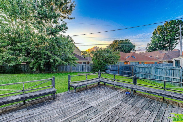 wooden deck with a lawn