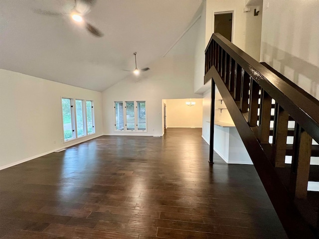 unfurnished living room with dark hardwood / wood-style floors, high vaulted ceiling, and ceiling fan