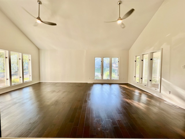 unfurnished living room with ceiling fan, dark hardwood / wood-style flooring, and high vaulted ceiling