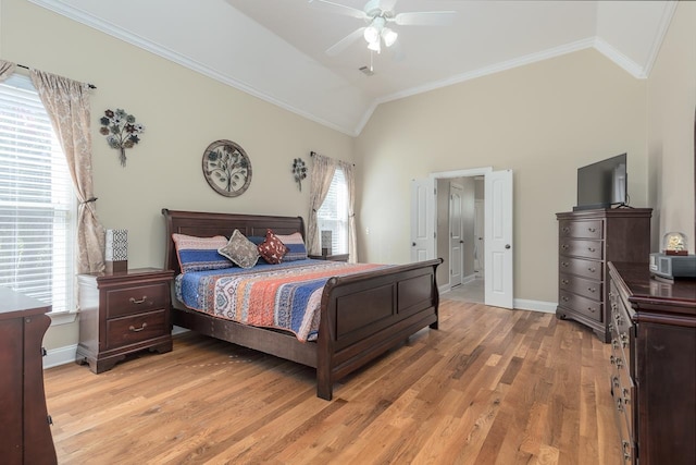 bedroom with multiple windows, wood-type flooring, vaulted ceiling, and ceiling fan