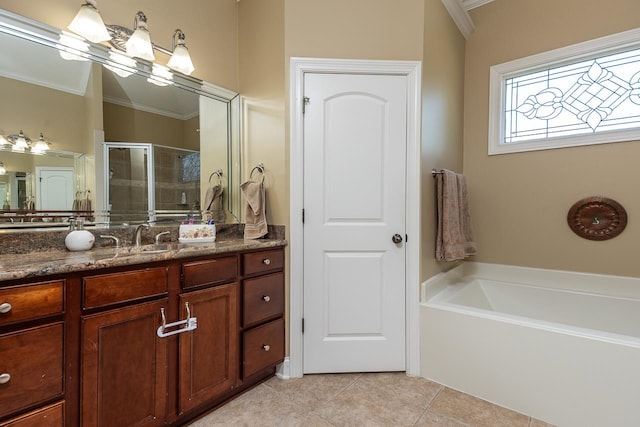 bathroom featuring independent shower and bath, vanity, ornamental molding, and tile patterned floors