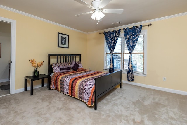 bedroom with ornamental molding, ceiling fan, carpet floors, and ensuite bathroom