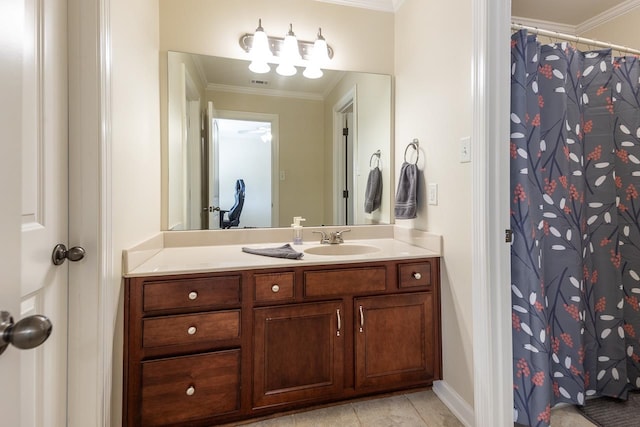 bathroom featuring ornamental molding, vanity, and tile patterned floors