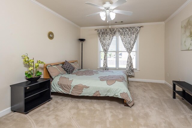 carpeted bedroom featuring ceiling fan and crown molding