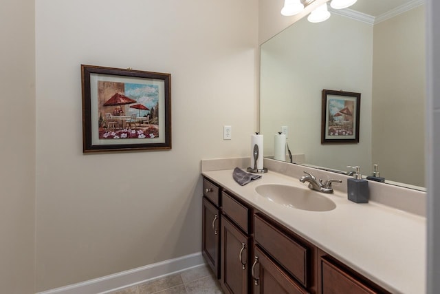 bathroom featuring ornamental molding, vanity, and tile patterned flooring