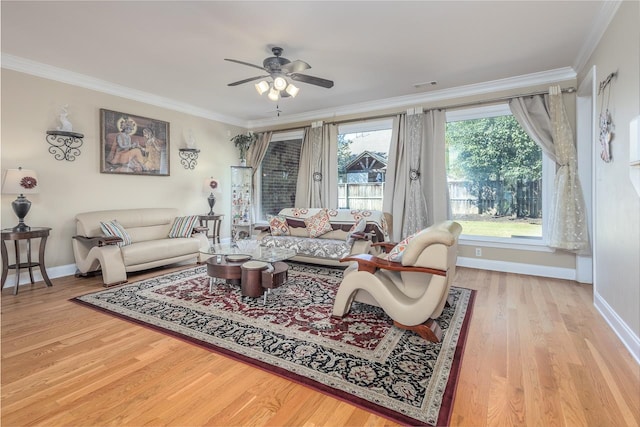 living room featuring ornamental molding, ceiling fan, and hardwood / wood-style flooring