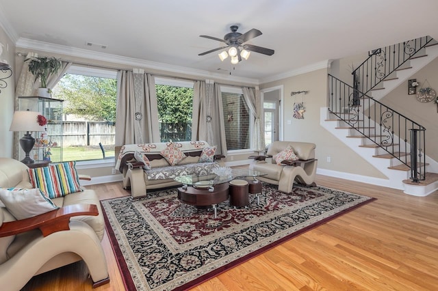 living room featuring ornamental molding, ceiling fan, and hardwood / wood-style flooring