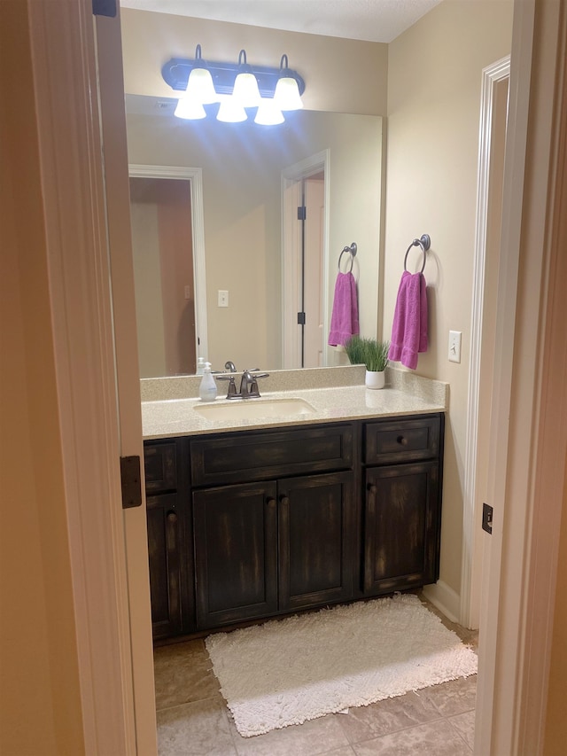 bathroom with vanity and tile patterned flooring