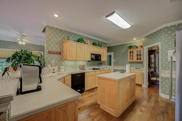 kitchen featuring ceiling fan, a kitchen island, light hardwood / wood-style floors, and black appliances